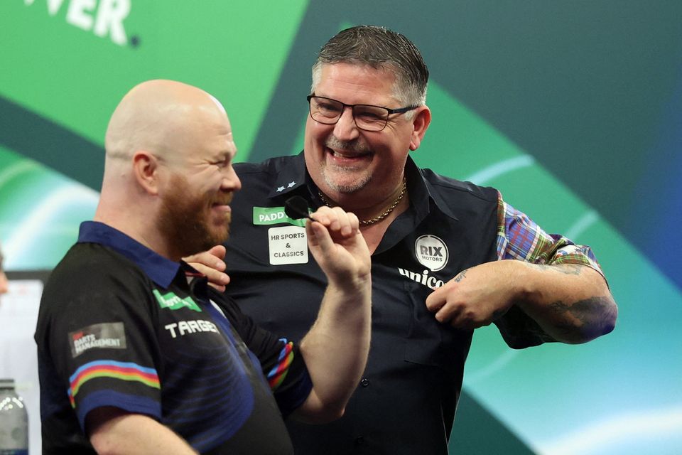 Gary Anderson reacts after winning his World Darts Championship quarter-final match against Justin Hood at the Alexandra Palace, London